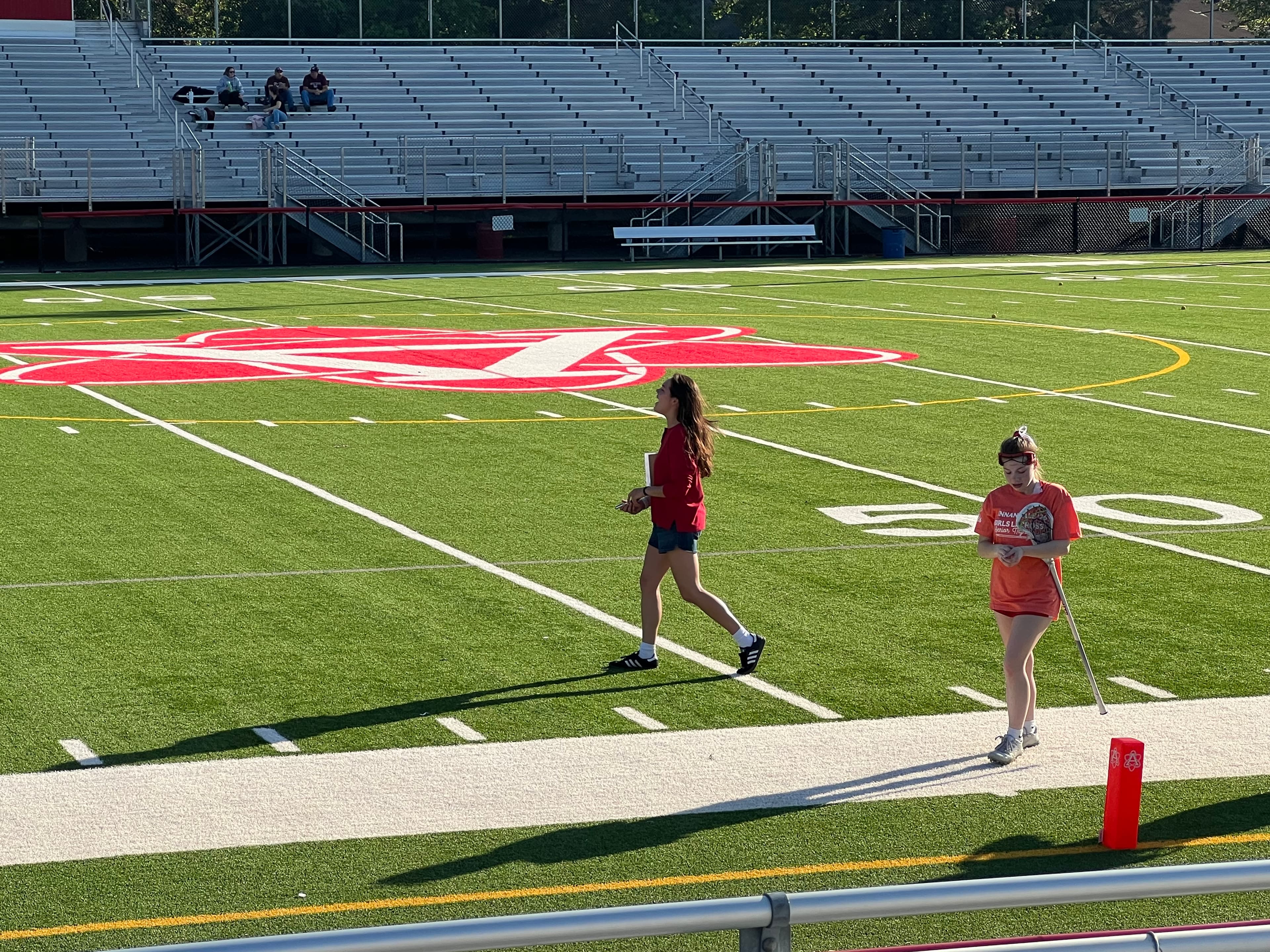 On the lacrosse field — coaching walk